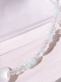 Rose Quartz necklace with moonstone and white jade. features a rose quartz donut