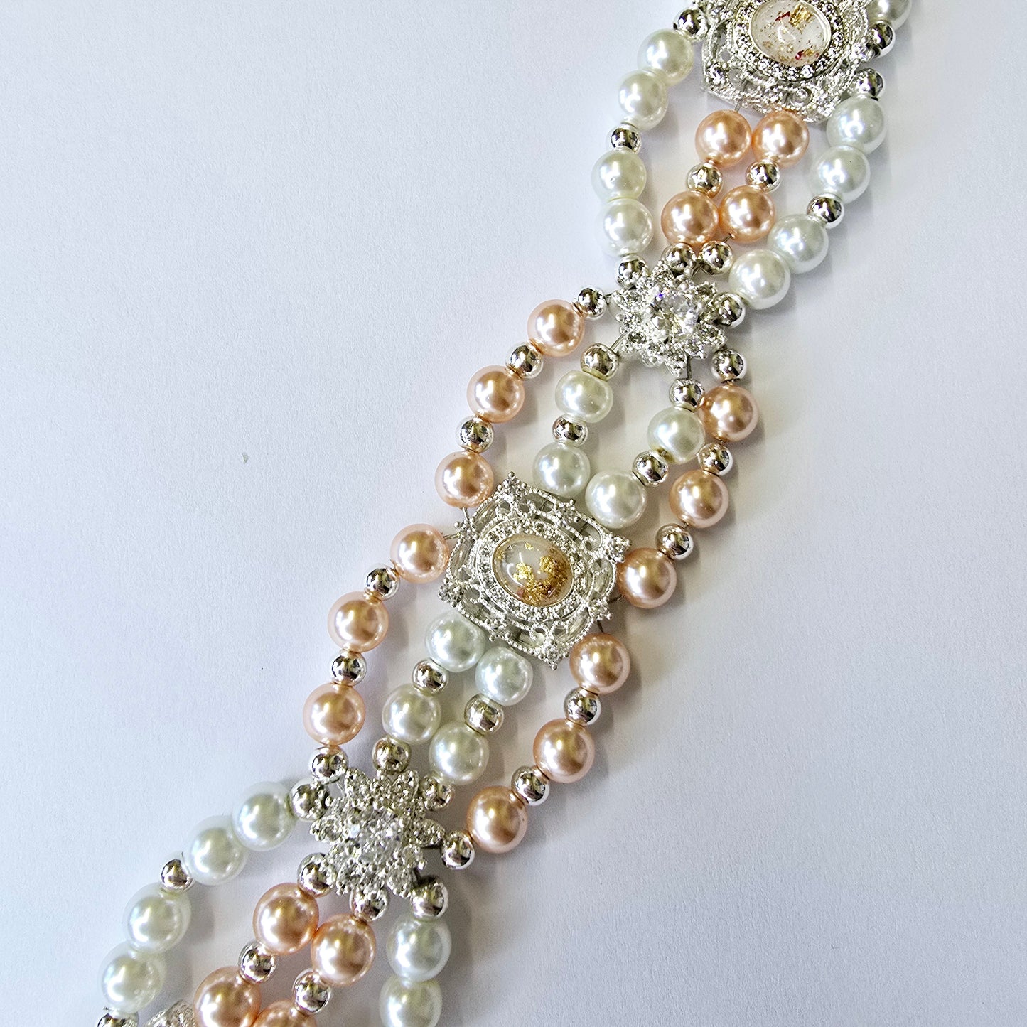 Peach and white shell pearl bracelet with beautiful silver and peach spacers