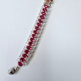 Stunning hot pink and clear rhinestone bracelet with flower spacer