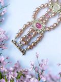 Pink shell pearl bracelet with pink and white charms