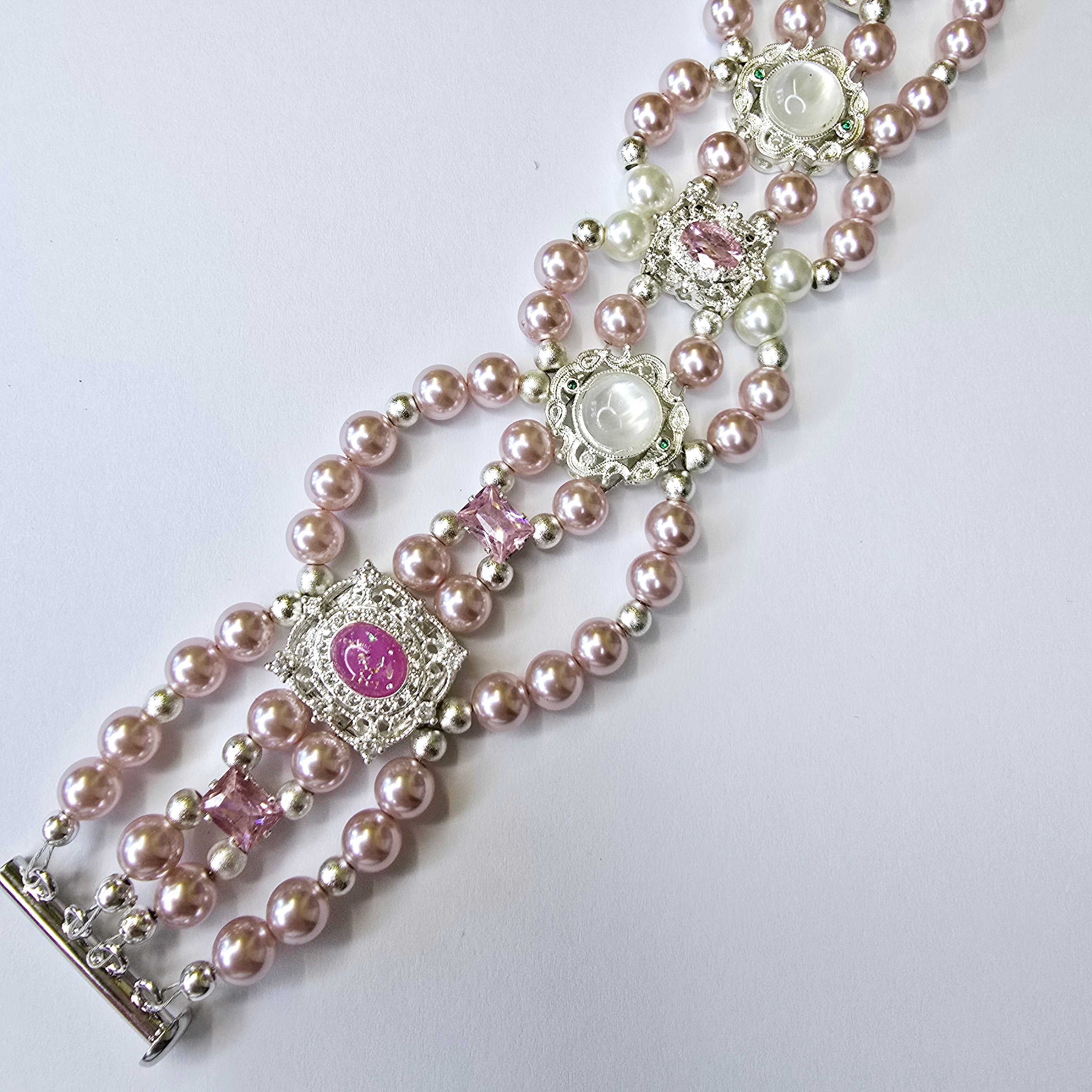 Pink shell pearl bracelet with pink and white charms