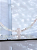 Rose Quartz necklace with moonstone and white jade. features a rose quartz donut